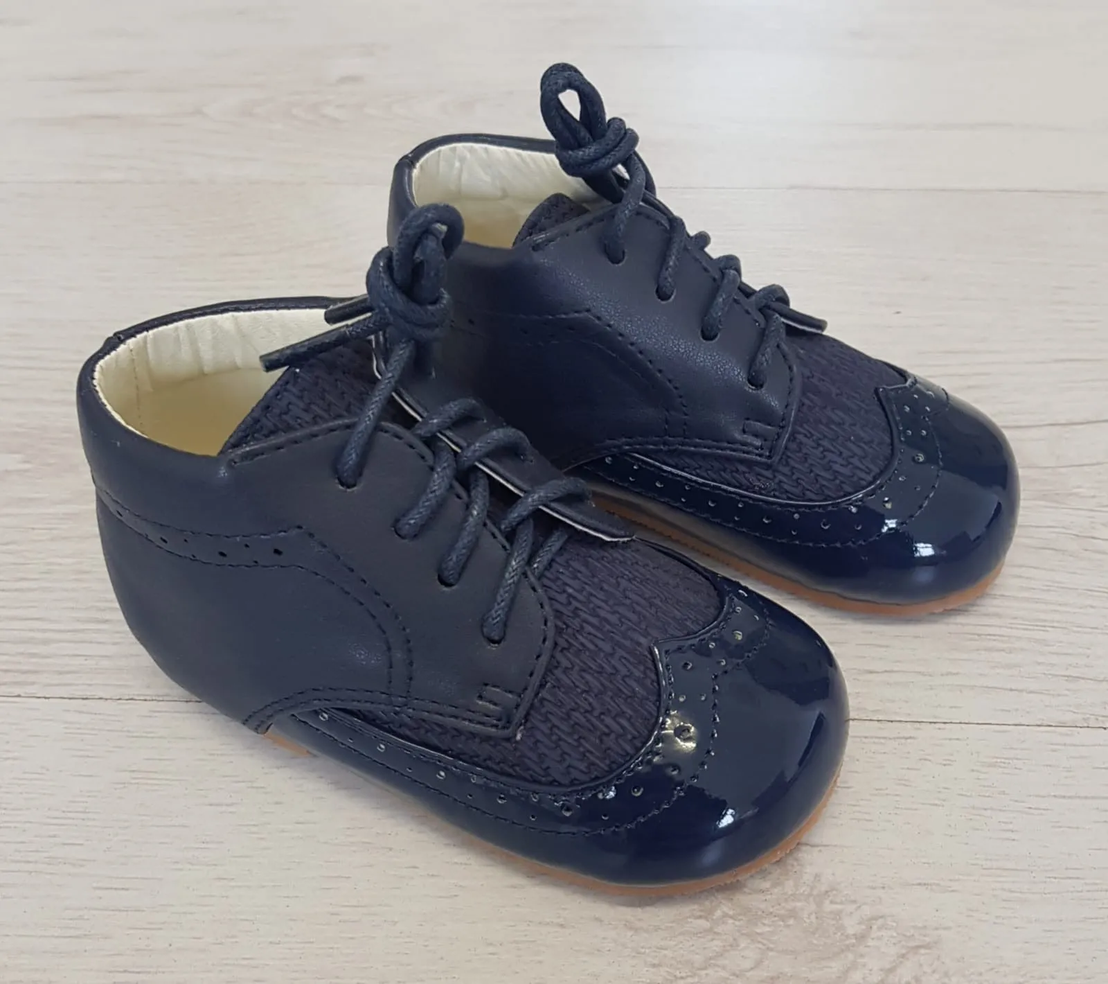 Navy brogue style boots